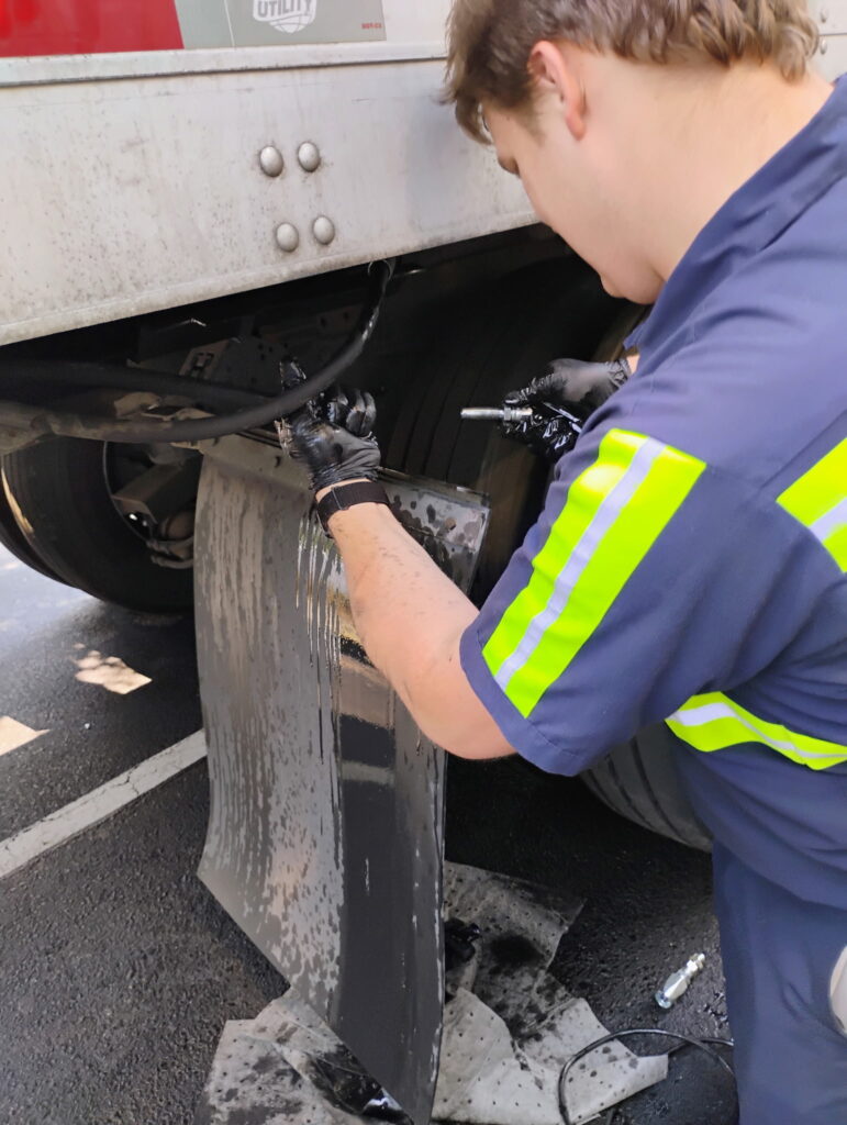 Larry Greasing Landing Gear